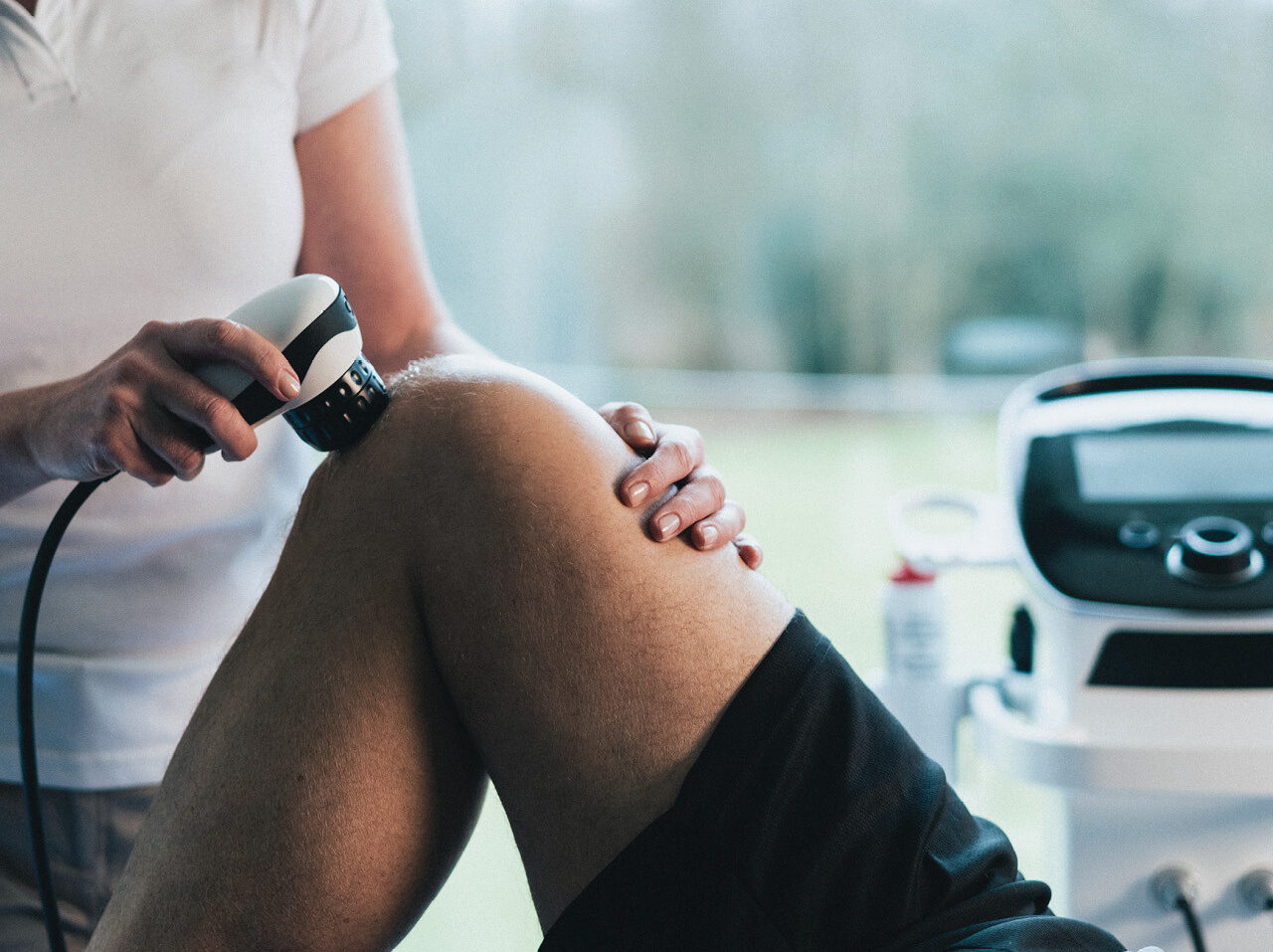 A picture of a patient receiving shockwave treatment