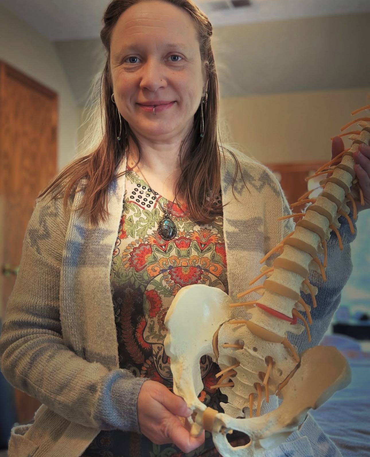 Image of Celeste Larson, LMT in her treatment room at East Burnside